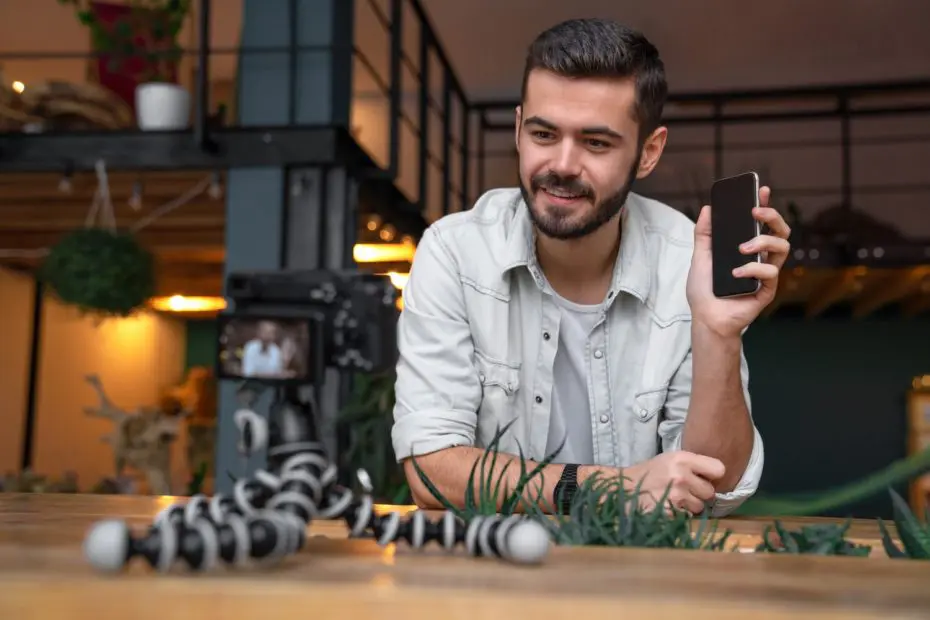 vlogger recording video for his vlog with mobile device