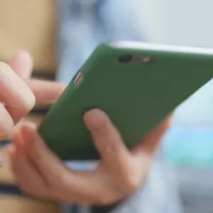 Person scrolling website on mobile phone