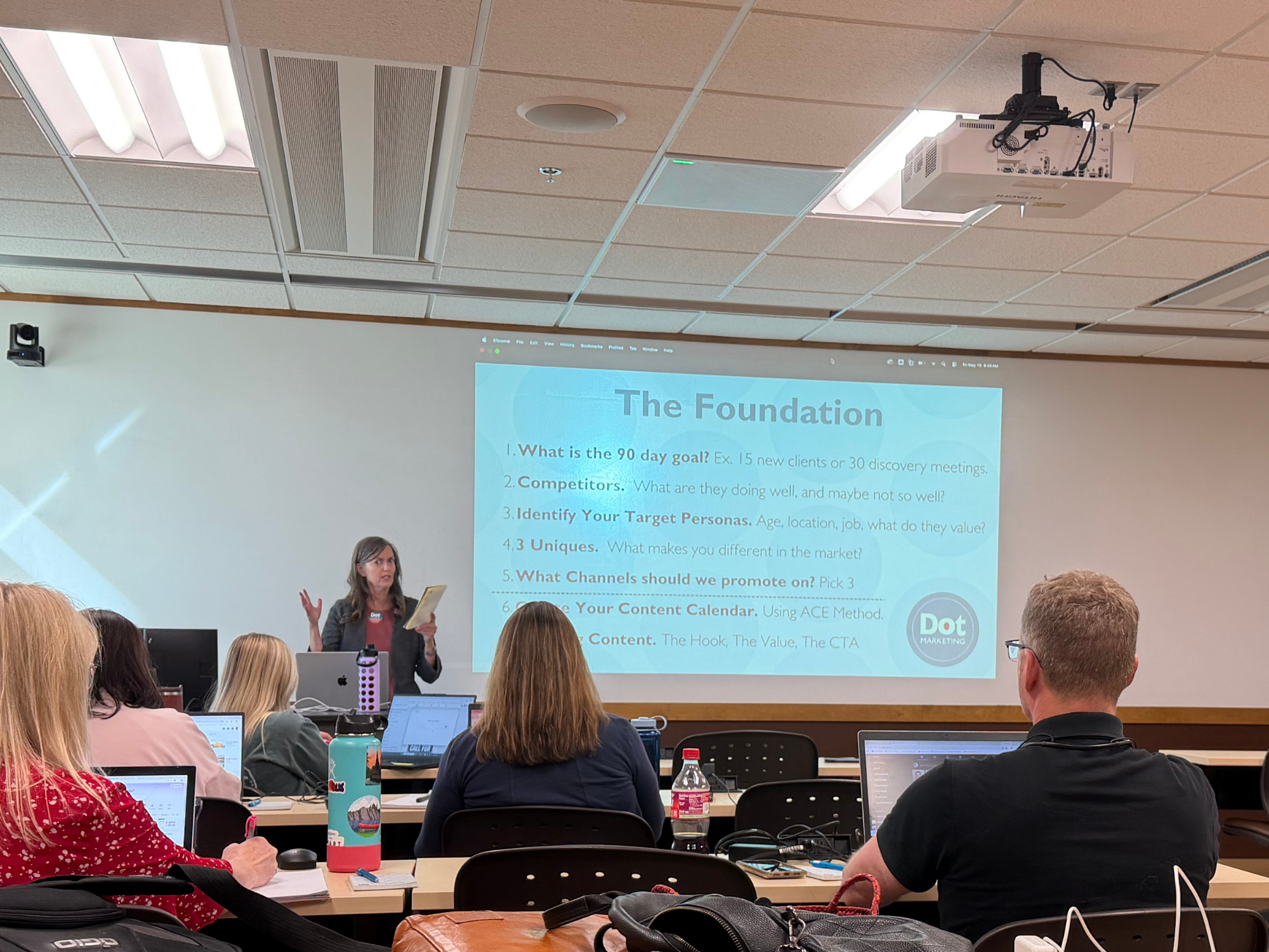 Angela presenting, asking attendees their goals