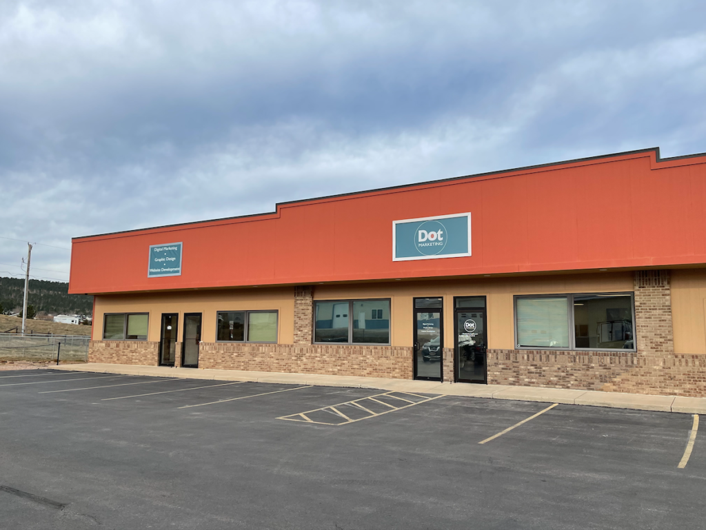 dot marketing and website design building outside - rapid city, sd