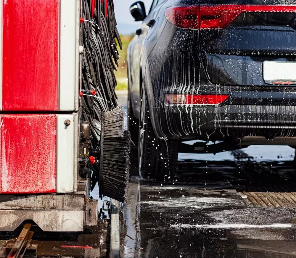 black car going through car wash