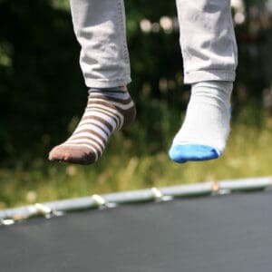 person bouncing on a trampoline